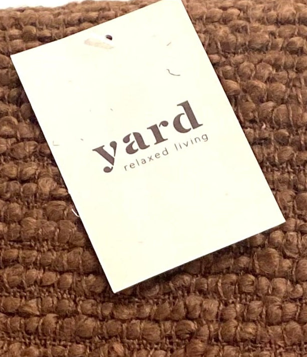 Brown textured blanket with a 'yard' tag on a white background