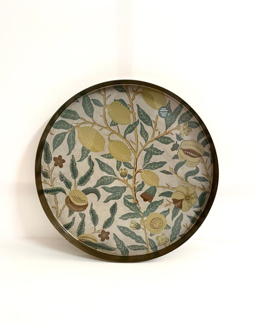 Decorative plate with floral and botanical design on a white background