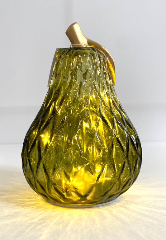 Decorative glass pear with gold top on a white background