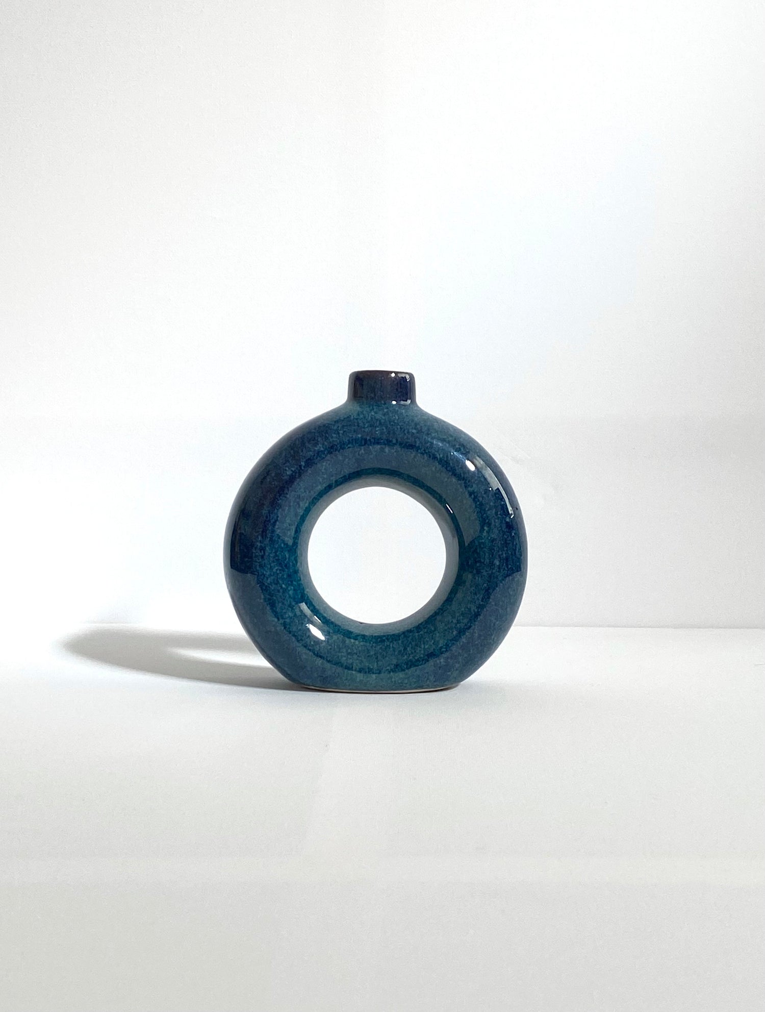 Blue ceramic donut vase background
