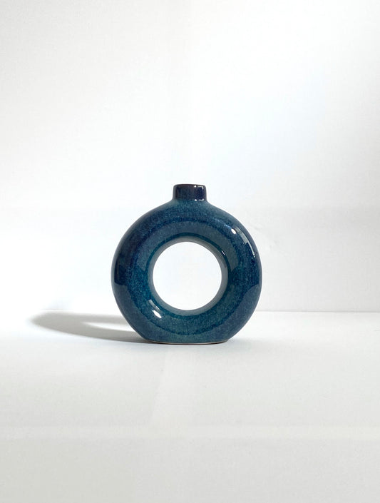 Blue ceramic donut vase background